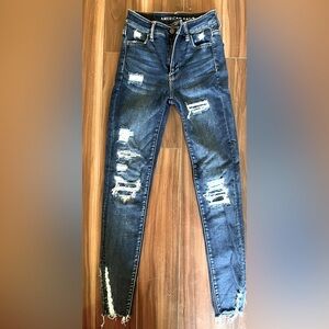 American Eagle Ne(x)t level stretch, tattered raw hem jeans size 0